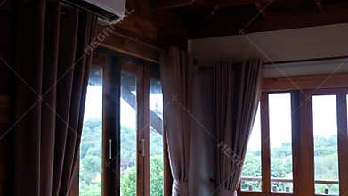 Serene wooden house with scenic view and smoke from air condition