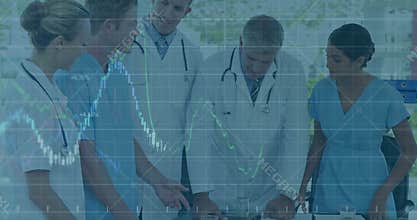 Senior physician calling team at glass table reviewing patient data via graphs adjusting treatment