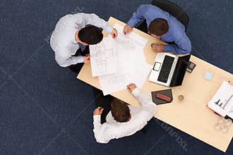 Architects talking about blueprints