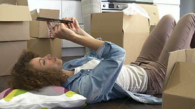 Slow Motion Shot Of Woman With Digital Tablet In New Home