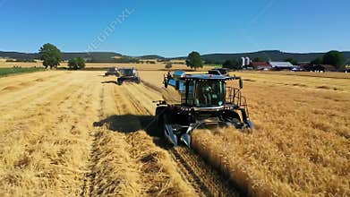 AI Harvesters in golden wheat field