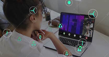 Mid-adult woman sitting facing NFT energy presentation starting with icons swirling around screen
