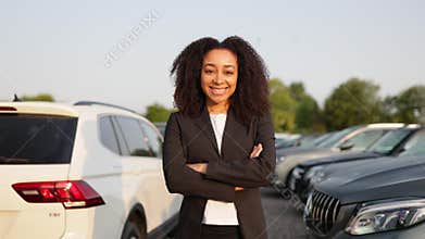 Woman Smiling at Car Dealership