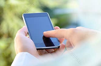 Close up of a man using mobile smart phone