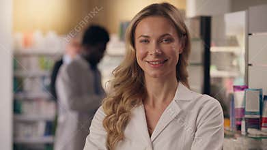 Smiling woman pharmacist doctor female Caucasian physician in white medical coat practitioner therapist pharmaceutical
