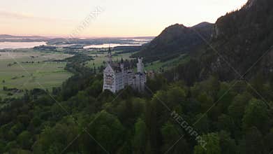 Aerial view of Neuschwanstein castle in Bavarian Alps, Germany, at Sunrise Morning Time. Fairytale Beautiful Castle 4k