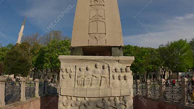 Ancient Egyptian Obelisk Against Blue Sky at Historic Location