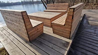 wooden seating with benches lined with natural wood in