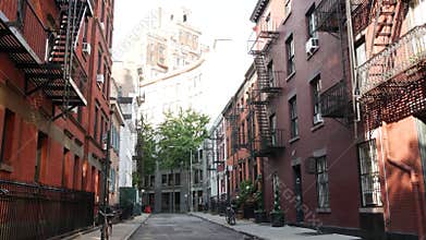 New York City building architecture. Urban residential house exterior. Real estate. Red brick facade
