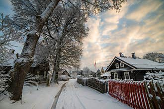 Village of wooden houses in winter time