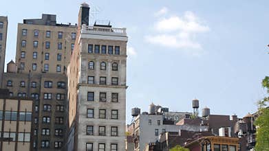 New York City Broadway, Manhattan midtown Union Square building architecture. Rooftop water tower.