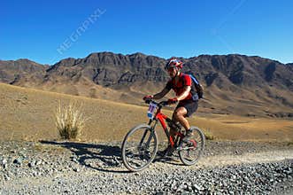 Mountain biker racing in desert