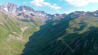Aerial Kackar Mountains Turkey valley stream and green meadows open across treeless alpine terrain, water, rocks, creek, turkiye