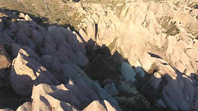Aerial drone view of Cappadocia fairy chimneys and sculpted volcanic valleys in Turkiye, rock formations, badlands, volcanic tuff