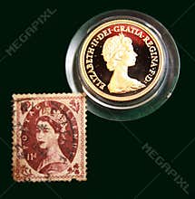 UK brown stamp with portrait of Elizabeth II and 1980 Australian Gold sovereign on black background