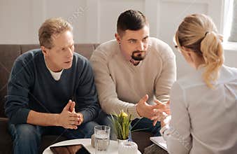 Sad depressed gay couple saving their relationships