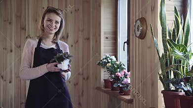 The woman with a violets in hands