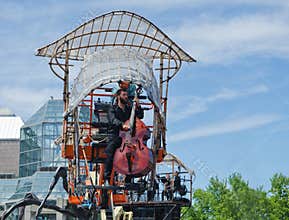 Musician up in the air playing a Double Bass instrument