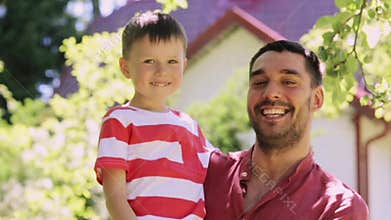 Happy father and little boy outdoors