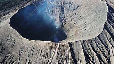 Mountain Bromo active volcano crater in East Jawa, Indonesia. Top view from drone fly. 4K footage