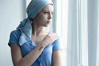 Cancer patient holding arm