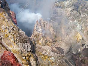 Steaming craters of Mount Etna with volcanic fumes