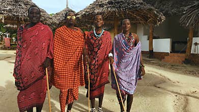 The Masai tribe dances national dance at sunset and bids farewell to the sun. 4K