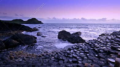 Sunset over rocks formation Giant`s Causeway, County Antrim, Northern Ireland