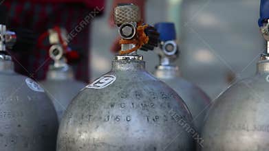 assistants prepare oxigen containers for diving
