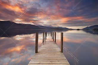 Flooded jetty in Derwent Water, Lake District, England at sunset