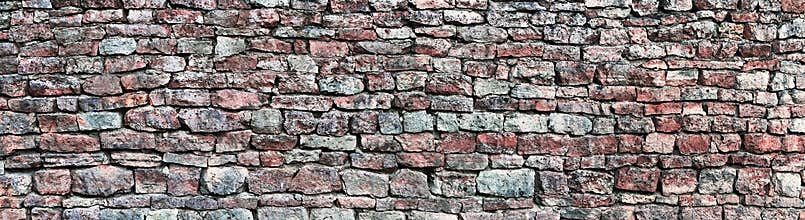 Stone wall panorama, panoramic stonewall pattern background, old aged weathered red and grey grunge limestone dolomite texture