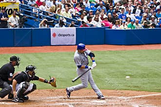Major League Baseball: Swingin at a pitch