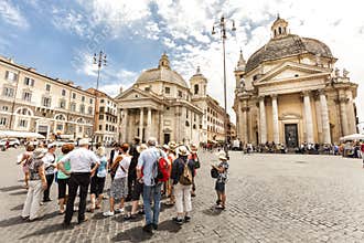 Tourists group with tour guide in Rome, Italy. Piazza del Popolo. Traveling