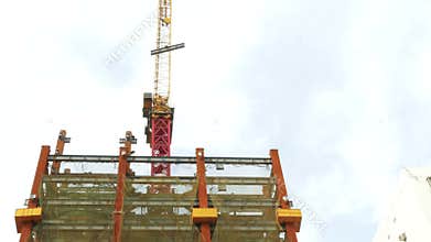 Tower crane on building moving I-beam