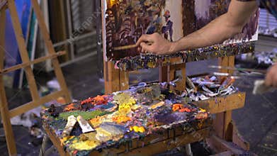 Senior man painting on a canvas