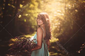 Smiling beautiful woman in sun daylight