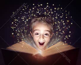 Child reading a magic story book