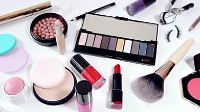 Collection of makeup cosmetics on white background