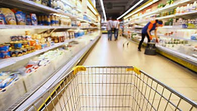 Moving shopping cart in a large supermarket