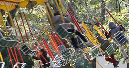 Carousel in a holiday park with kids