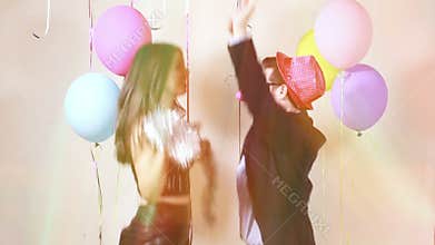 Slow motion of funny crazy couple having awesome time dancing