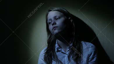 Scared teen girl in a dark. 4K UHD.