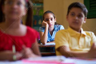 Bored Female Student Latina Girl In Class At School