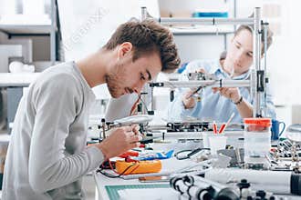 Engineering students working in the lab