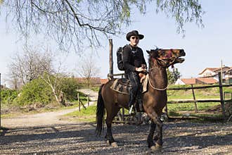 Man is riding a horse
