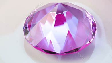 Pink shiny diamond on rotating plate