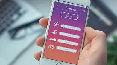 Checking fitness goals on sport app on the smartphone