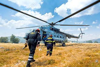 Helicopter and firefighters