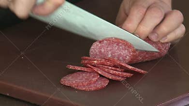 Cut sausage with a knife