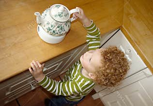 Child taking Teapot